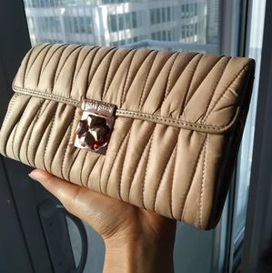 Folli Folli beige and rose gold clutch